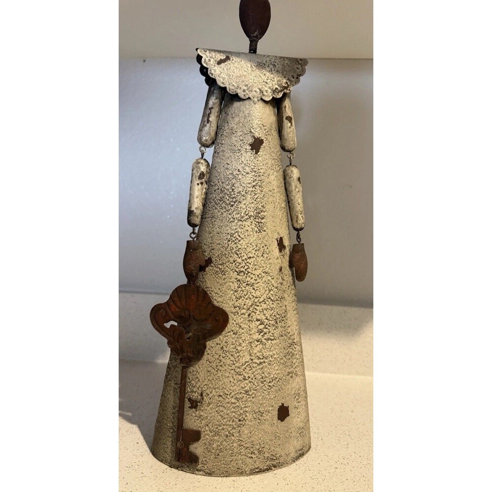 VTG decorative rustic metal sculpture of a stylized figure holding a large key.